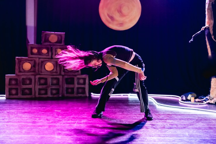 Maddie Wakeling dancing with her hair flying in Roadside
